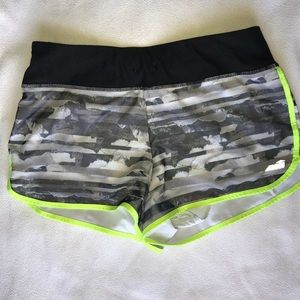 Black and neon yellow athletic shorts.